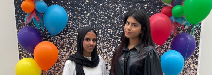 Two students celebrating their results